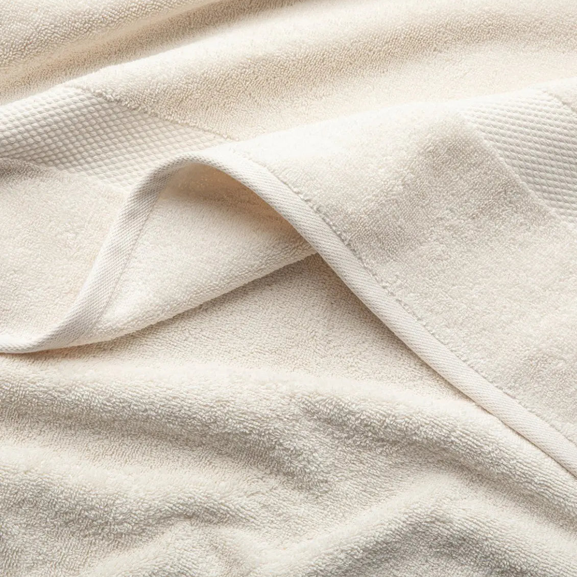 Close-up of beige Premium Turkish Cotton towel with a textured pattern