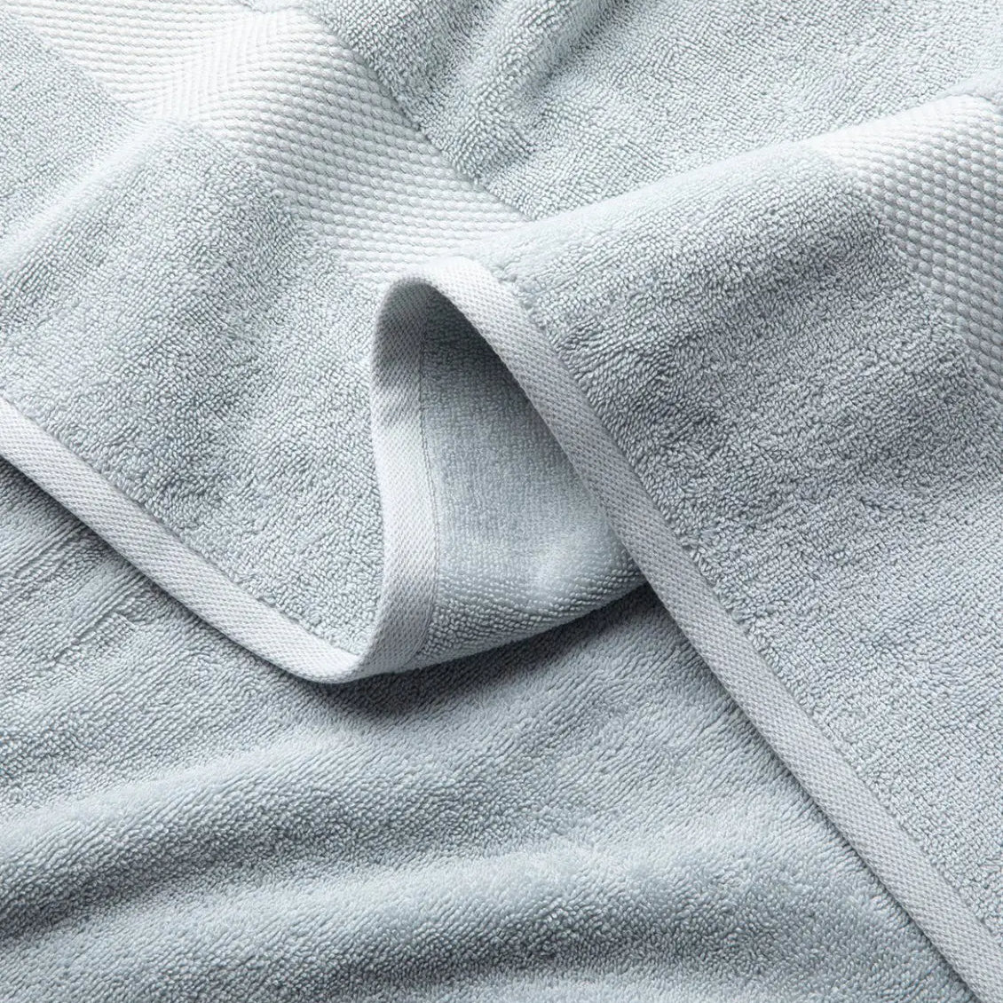 Close-up of a light blue Premium Turkish Cotton towel with textured surface