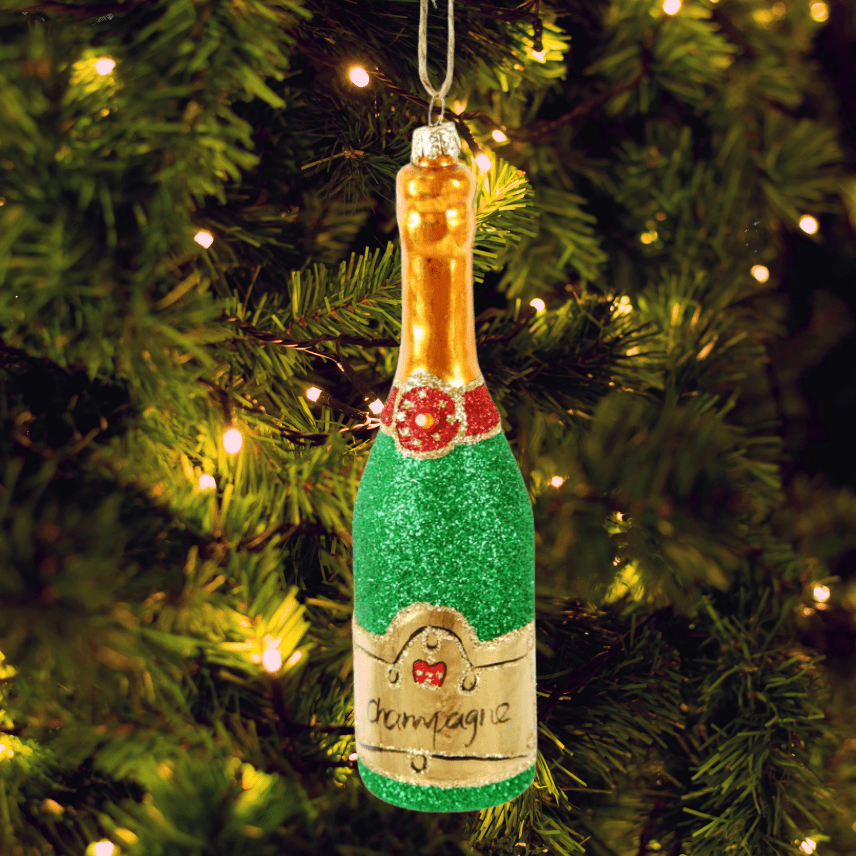 Decorative champagne bottle ornament on a Christmas tree | Duman Home