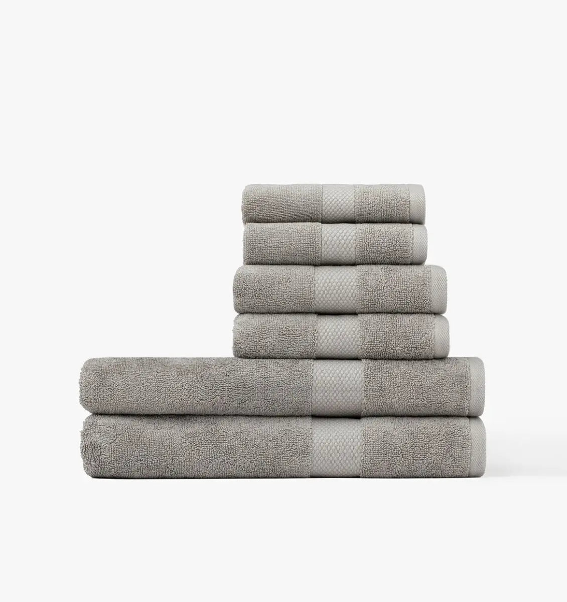 Stack of gray Turkish Cotton towels on a white background