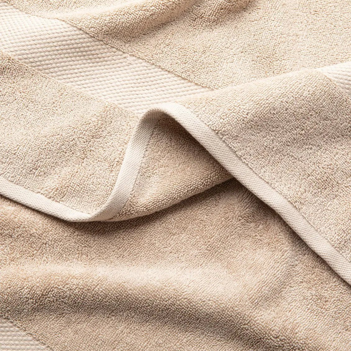 Close-up of a beige Turkish Cotton towel with textured surface