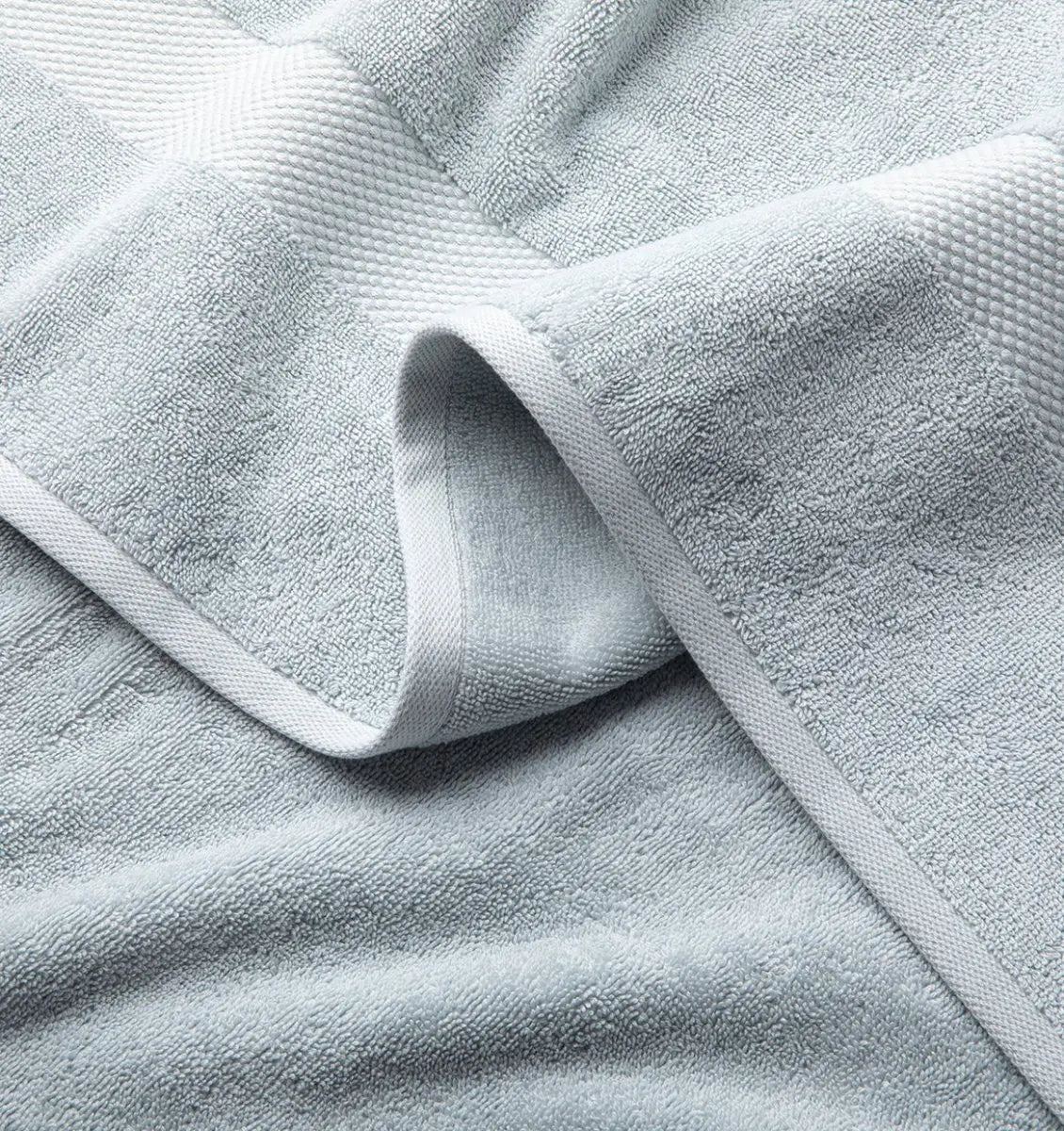 Close-up of a light blue Premium Turkish Cotton towel with textured surface