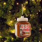 Decorative Nutella jar ornament with 'fa la la nutella' text on a Christmas tree | Duman Home