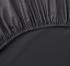 Close-up of a slate gray fitted sheet 