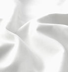 Close-up of white sheet set fabric with folds 